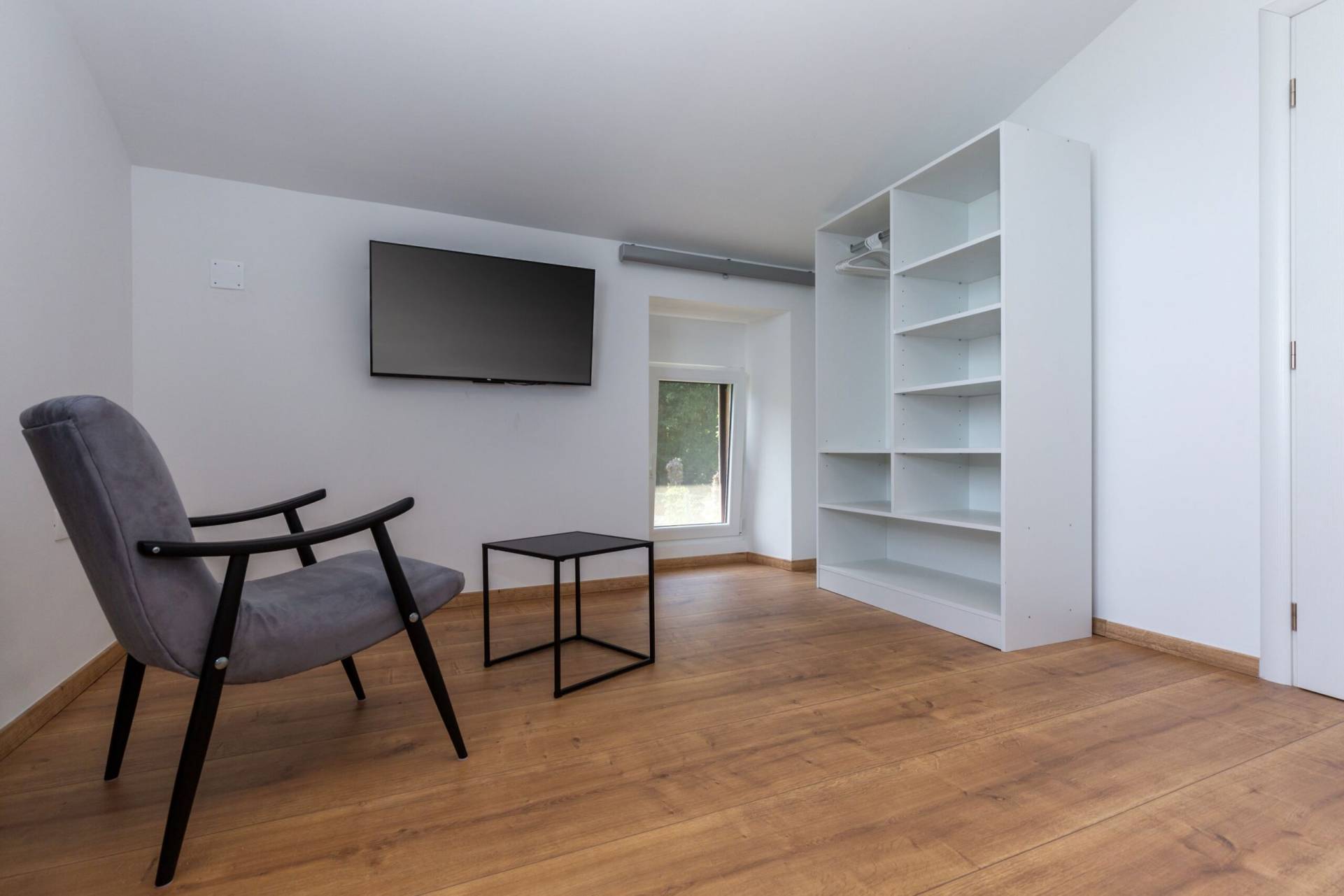 Bedroom tv and chair with closet